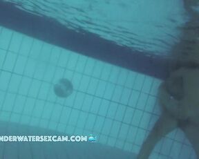 Late night sex underwater in a public pool with a hot girl