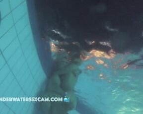 Late night sex underwater in a public pool with a hot girl