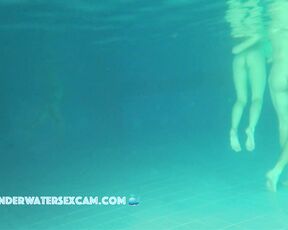 Sweet young teen 18+ couple is playing underwater