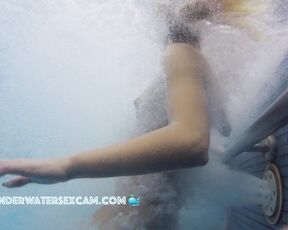Pierced teen uses the underwater jet stream