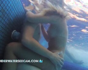 He is really trying an underwater tit fuck