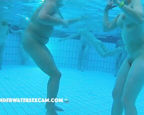 Nice milf dancing in a public sauna pool