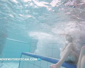 Two sweet young girls on an underwater bench