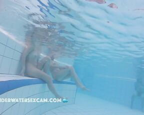 Two very beautiful teen girls on an underwater bench