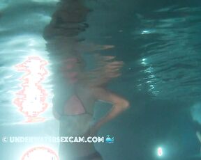 Cute teen girl in bikini in a public pool