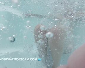 Girl is hiding behind bubbles in jacuzzi
