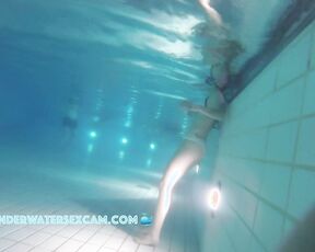 Cute teen girl enjoys an underwater massage