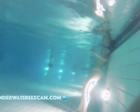 Cute teen girl enjoys an underwater massage