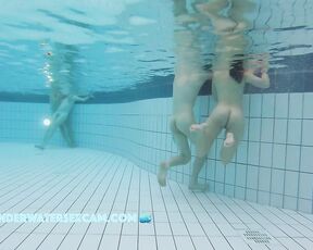 A pretty young girl attracts everyone's attention when she enters the pool