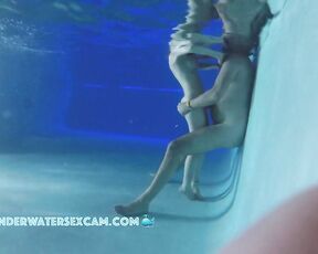 She is so small and he is so tall that she can only stand on tiptoe in the pool