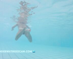 NEW! This Asian lady swims around in the pool and relaxes with underwater massage