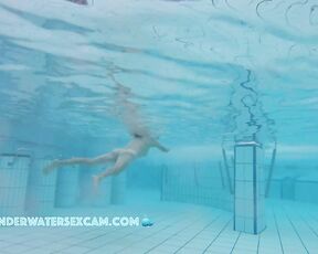 NEW! This Asian lady swims around in the pool and relaxes with underwater massage