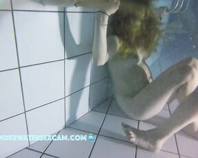 NEW! This red-haired beauty loves to dive underwater