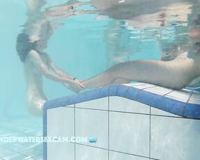 NEW! A young couple visibly enjoys playing together naked in the pool