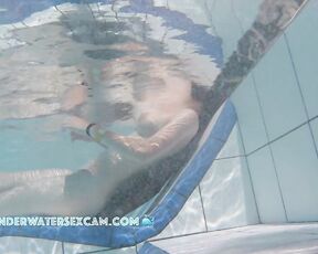 NEW! A young couple visibly enjoys playing together naked in the pool