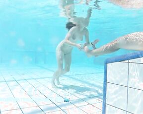 NEW! A young couple visibly enjoys playing together naked in the pool