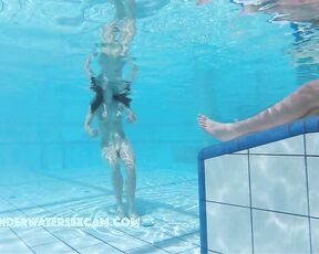 NEW! A young couple visibly enjoys playing together naked in the pool