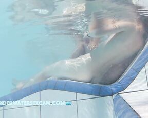 NEW! A young couple visibly enjoys playing together naked in the pool