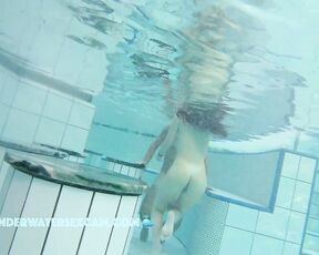 NEW! A pretty young couple playing in the water and I think she wants to do a lot more