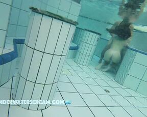 NEW! A pretty young couple playing in the water and I think she wants to do a lot more