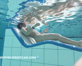 NEW! This hot Latina shows off her fantastic body on an underwater lounger.