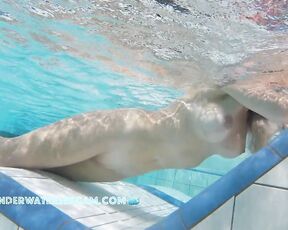 NEW! This horny MILF with beautifully enhanced breasts masturbates shamelessly with underwater jets.