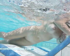 NEW! This horny MILF with beautifully enhanced breasts masturbates shamelessly with underwater jets.