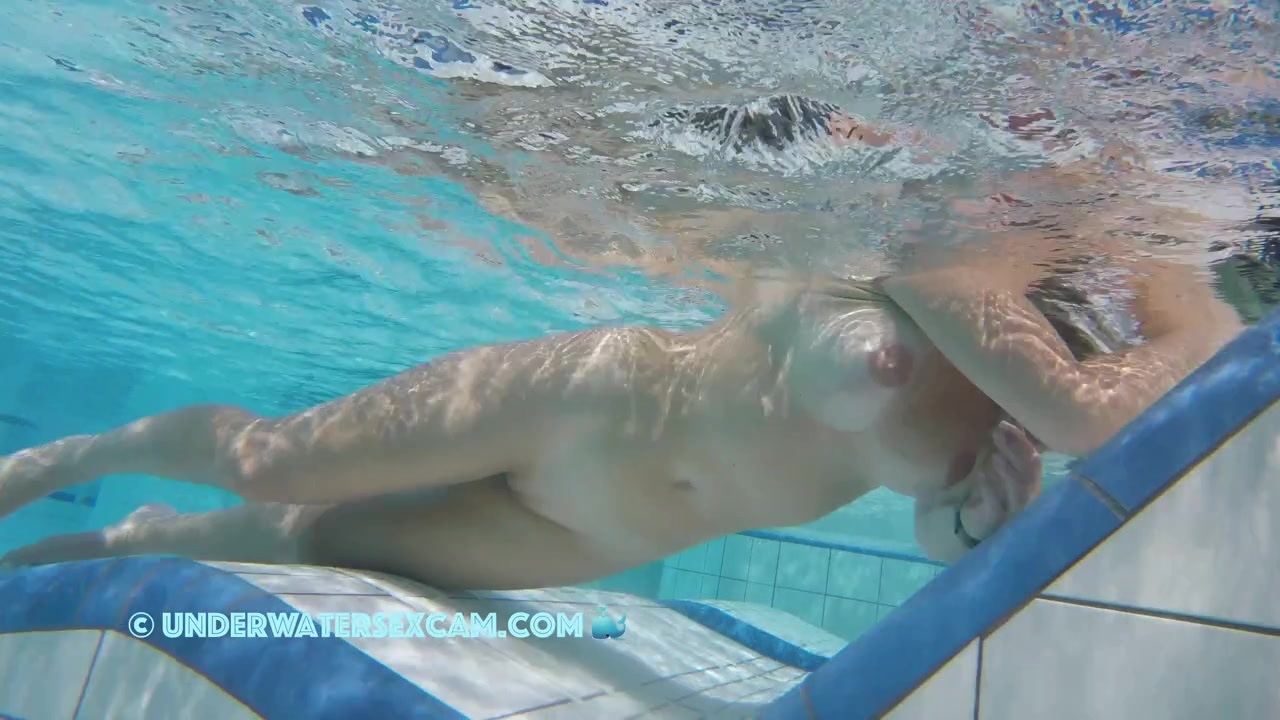 NEW! This horny MILF with beautifully enhanced breasts masturbates shamelessly with underwater jets.
