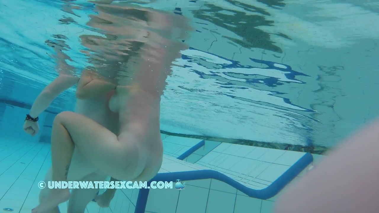 NEW! A cute girl with a great body enjoys an underwater back massage.