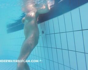 NEW! This pretty girl wants everyone to see her big breasts because they don't look so saggy in the water.