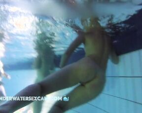 NEW! Athletic young woman does her underwater exercises extra close so that I can observe her well.