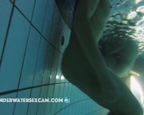 NEW! Athletic young woman does her underwater exercises extra close so that I can observe her well.
