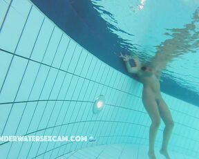 NEW! This busty MILF is admired by an admirer.