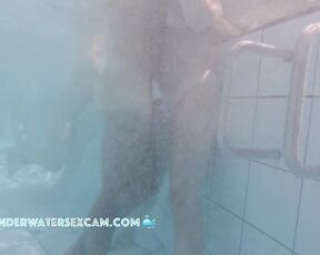 NEW! Cute young couple gets horny with each other in the sauna pool while the voyeur watches