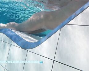 NEW! This lady is really enjoying the underwater jets built into the lounger.