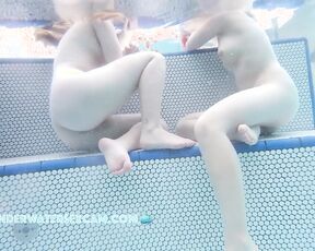 NEW! The two cute girls have this sexy way of sitting, but only because they're naked.