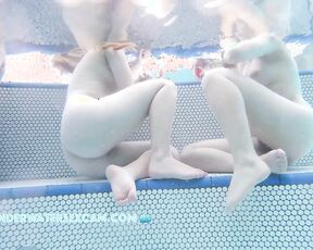 NEW! The two cute girls have this sexy way of sitting, but only because they're naked.