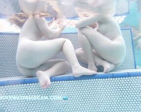 NEW! The two cute girls have this sexy way of sitting, but only because they're naked.