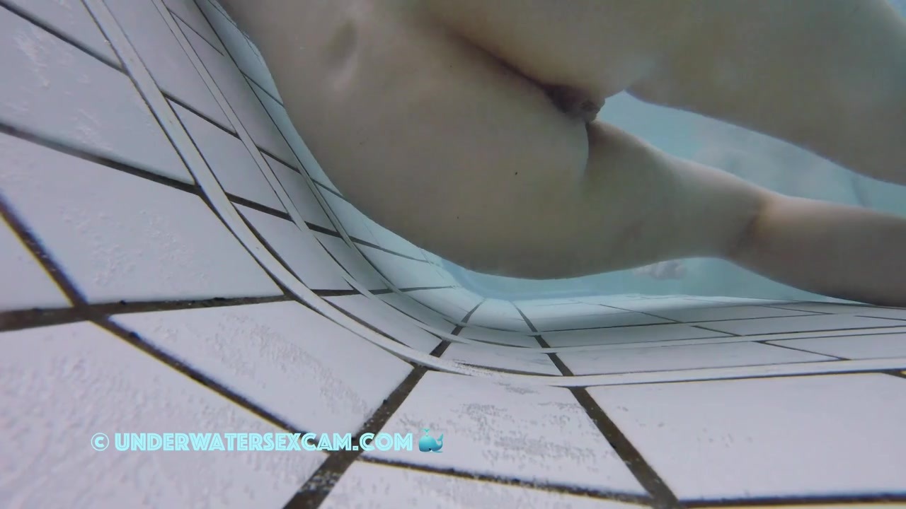 This delicate girl is trying out the massage jets in the underwater loungers.