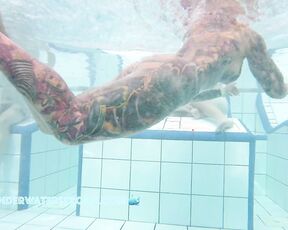 NEW! She looks like she's wearing a swimsuit, but she's completely naked.