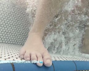 NEW! This girl is very close to me and is having fun with the bubbles in the jacuzzi.