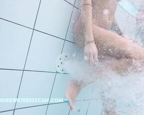 NEW! This horny MILF enjoys getting a little massage and looks at all the dicks around her while she does it.