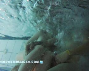 NEW! The girl is so horny in the pool! She kindly gives him a hand job but keeps fingering herself.