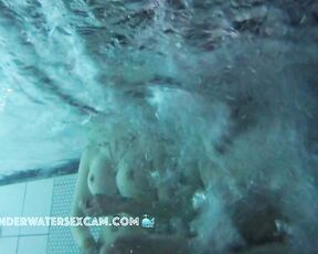 NEW! The girl is so horny in the pool! She kindly gives him a hand job but keeps fingering herself.