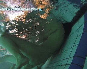 NEW! This girl is surprised by the underwater jets in the lounger, but then she realizes what she can do with them.