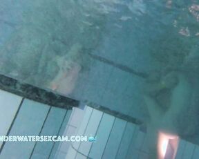 NEW! A couple is doing something underwater, and the husband of the other woman next to them gets an erection from watching.