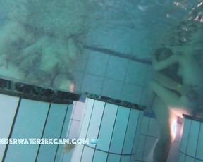 NEW! A couple is doing something underwater, and the husband of the other woman next to them gets an erection from watching.