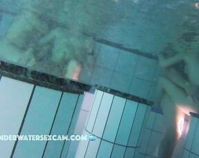 NEW! A couple is doing something underwater, and the husband of the other woman next to them gets an erection from watching.