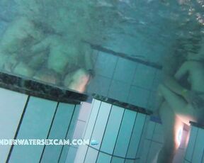 NEW! A couple is doing something underwater, and the husband of the other woman next to them gets an erection from watching.
