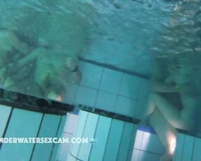 NEW! A couple is doing something underwater, and the husband of the other woman next to them gets an erection from watching.